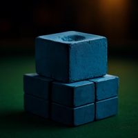 Stack of blue billiard chalk cubes