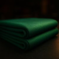 Folded bolt of green worsted billiard table cloth