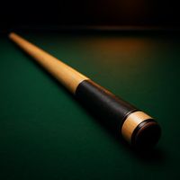 Two-piece maple pool cue on green baize